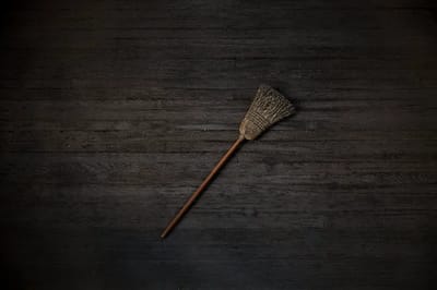 A broom placed upside down