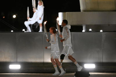 French flag bearers Alexis Hanquinquant and Nantenin Keïta's relay