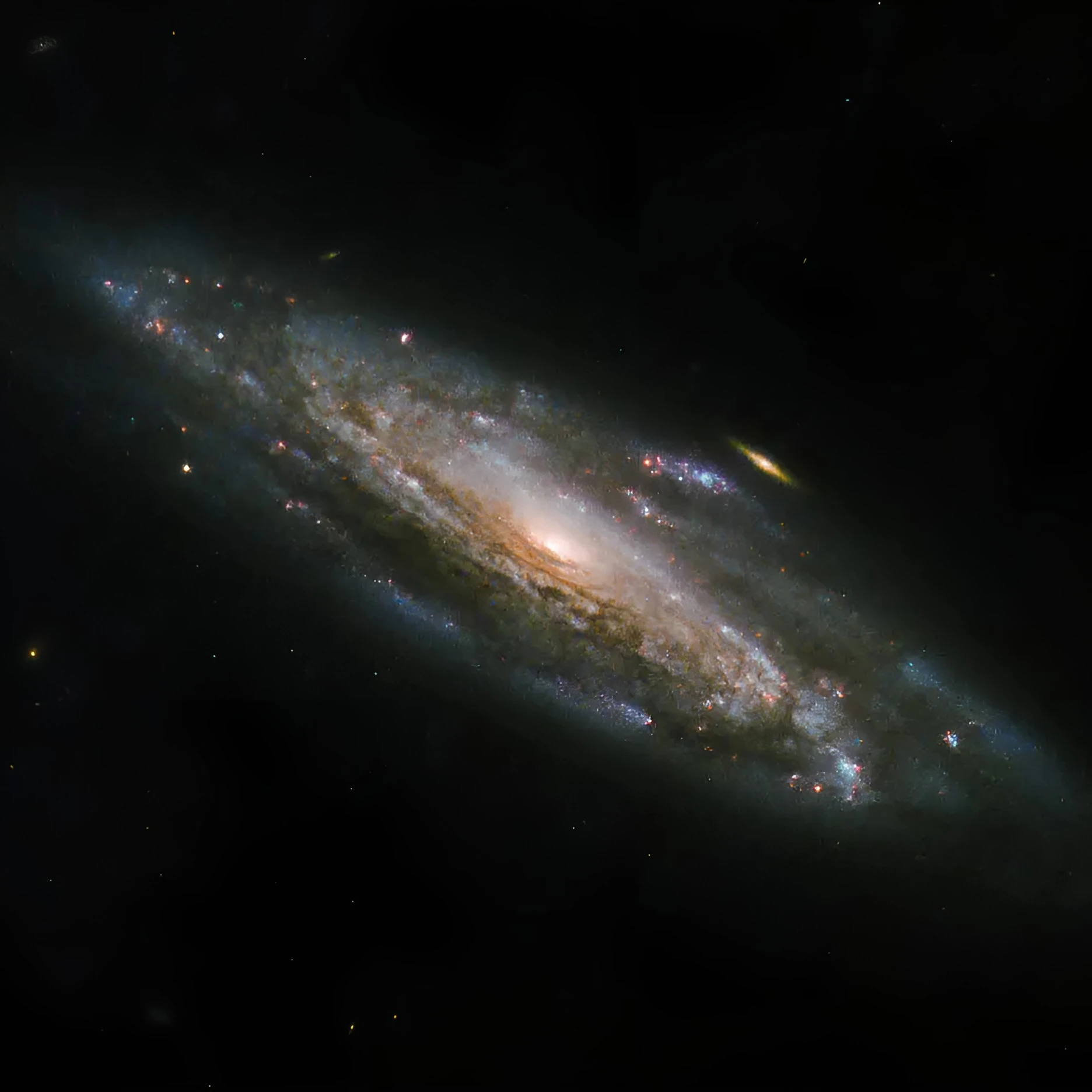 Des étoiles naissantes dans les bras d'une galaxie spirale